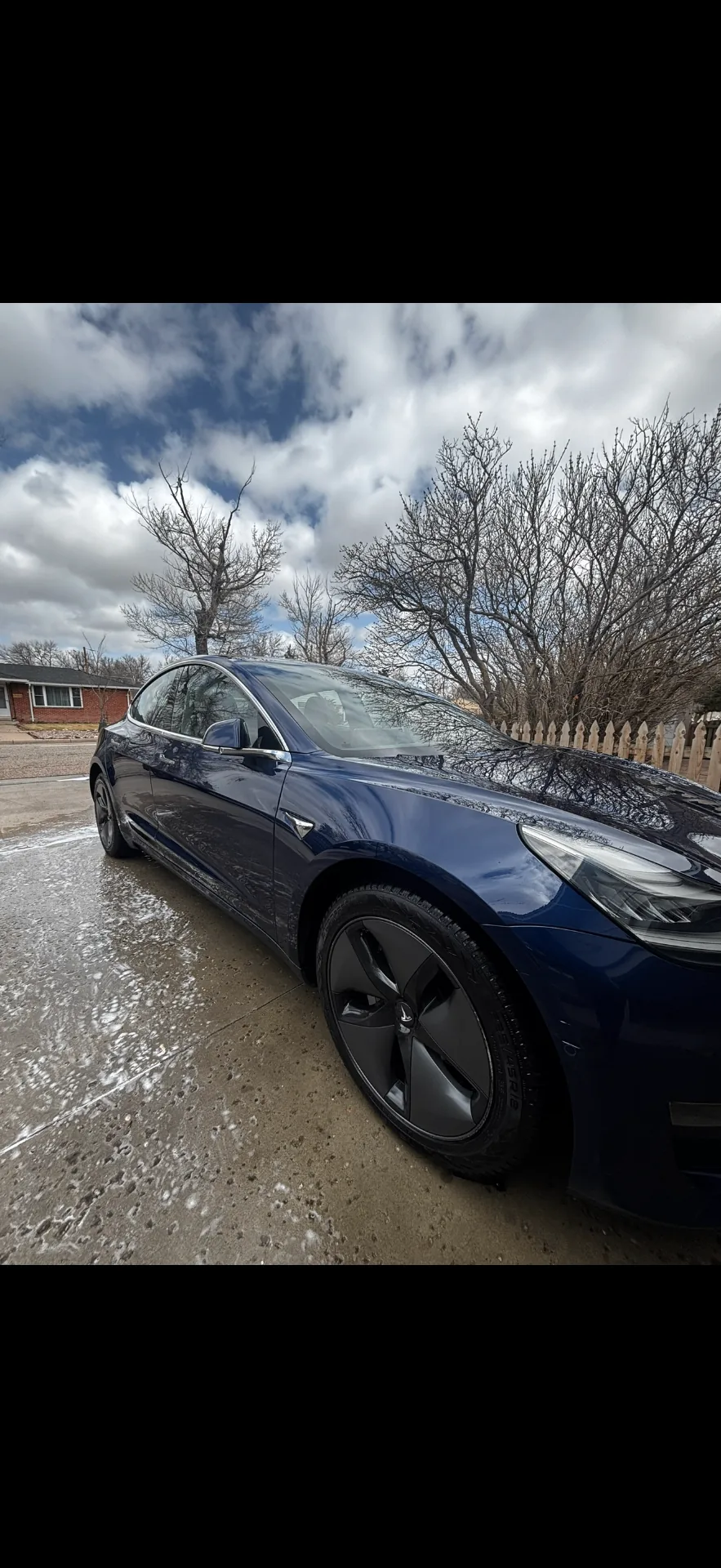 Detailed blue Tesla with glossy finish