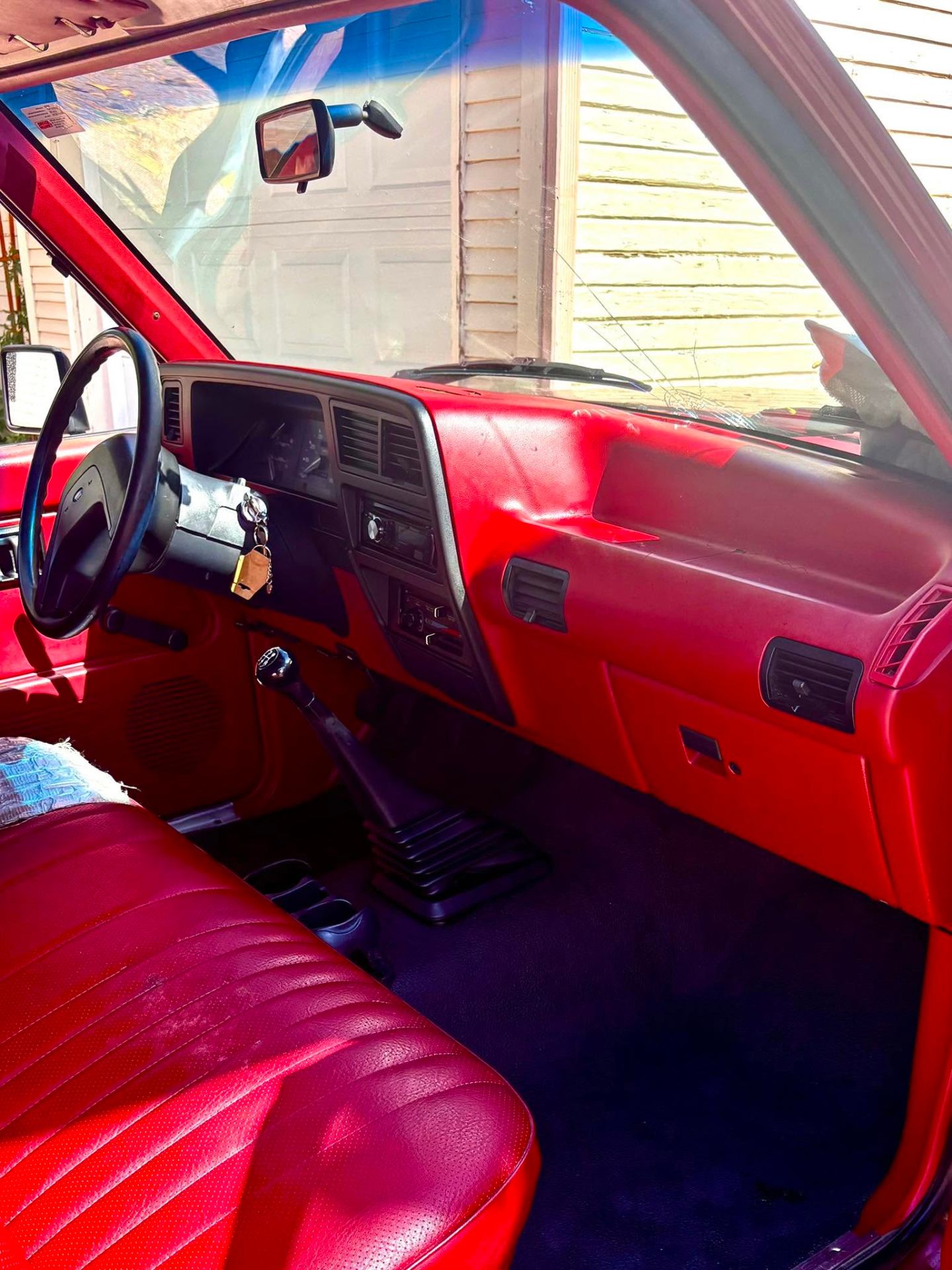 Worn red classic truck interior before detailing