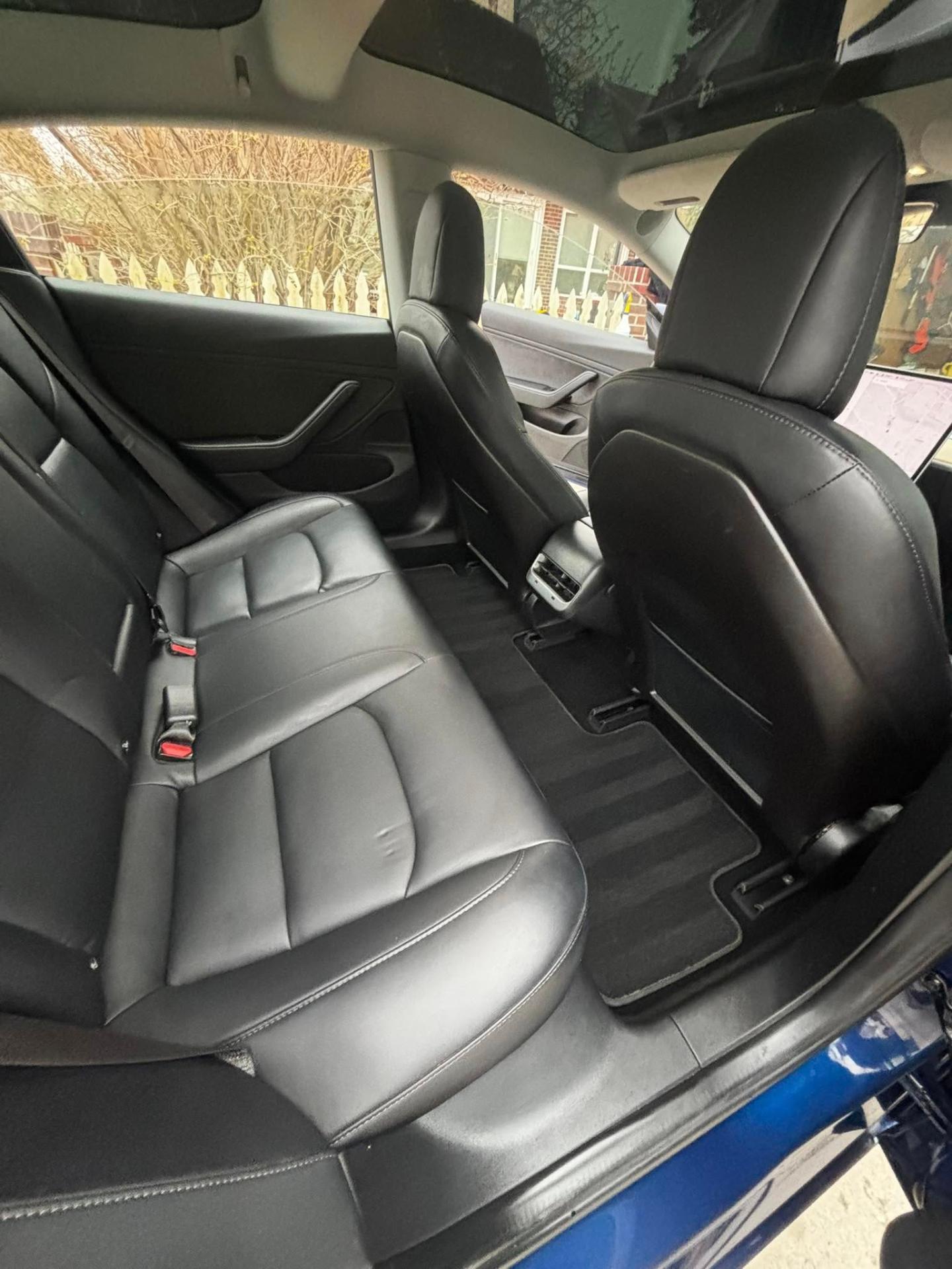 Clean Tesla rear seats and floor mats